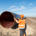 pipeline-workers-measuring-tube-length-construction-gas-oil-pipes-1.png